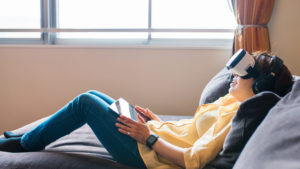 Woman reclining with VR headset